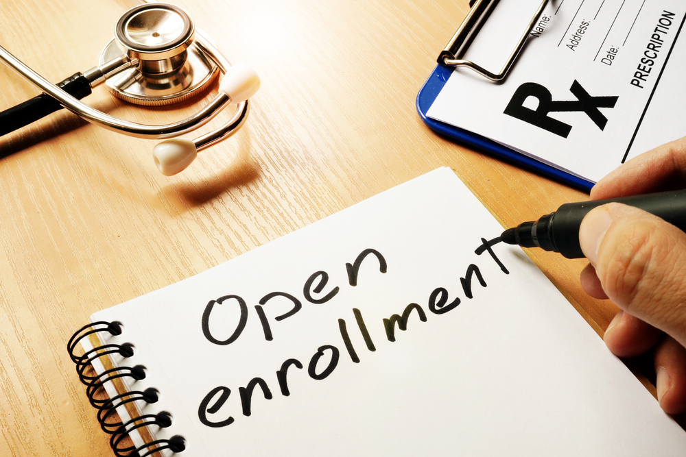 Open,enrollment,written,on,a,note,and,medical,stethoscope.